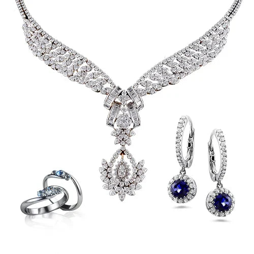 Elegant jewelry set featuring a diamond-encrusted necklace, sapphire and diamond earrings, and intertwined silver rings with blue gemstones. Luxurious and sophisticated.