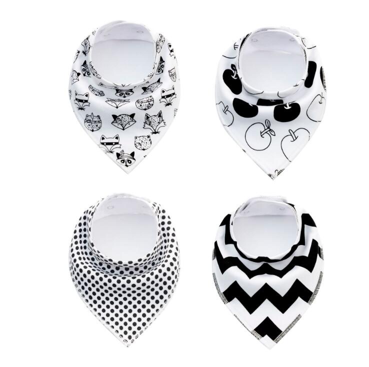 Set of 4 Nova Mart baby bibs and burp cloths with arrow, wave, and triangle prints, made of soft cotton bandana fabric.