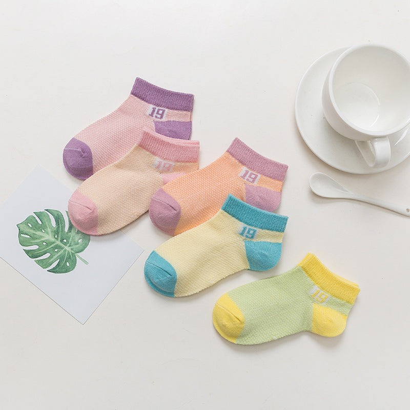 Soft, breathable cotton baby socks for boys and girls by Nova Mart, featuring cozy, stretchy fabric and colorful designs.