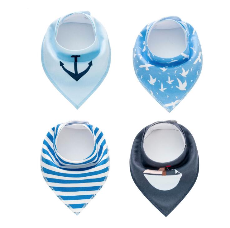 Set of 4 Nova Mart baby bibs and burp cloths with arrow, wave, and triangle prints, made of soft cotton bandana fabric.