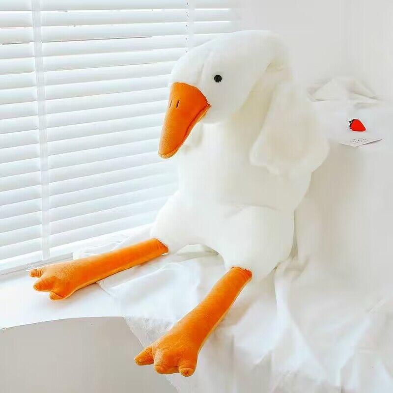 Cute white goose plush pillow toy from Nova Mart, soft and cuddly with detailed features, perfect for cozy decor or play.