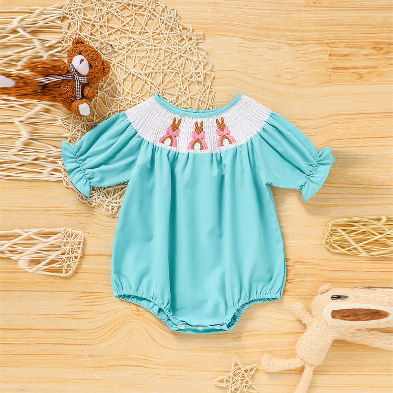 Baby girl in Nova Mart bunny romper set with bubble sleeves, bow, and rabbit embroidery, soft and comfortable for her.