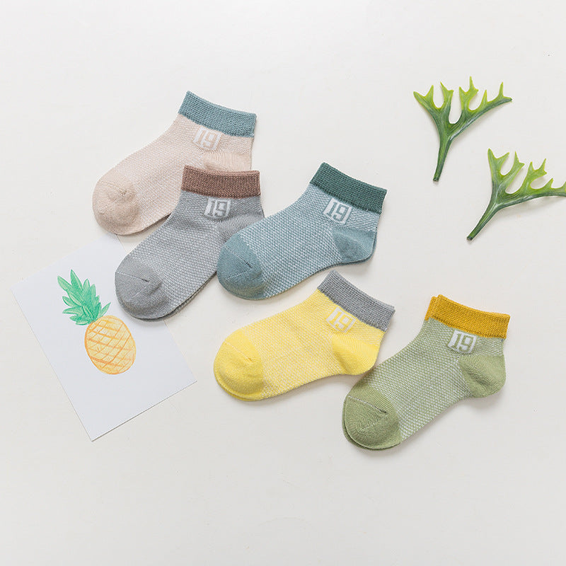 Pair of breathable cotton baby socks for boys and girls, soft and comfortable, from Nova Mart, suitable for delicate baby feet.