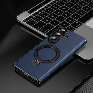 Blue phone case with a ring holder on a laptop keyboard