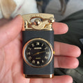 Lighter with clock face design held in a hand