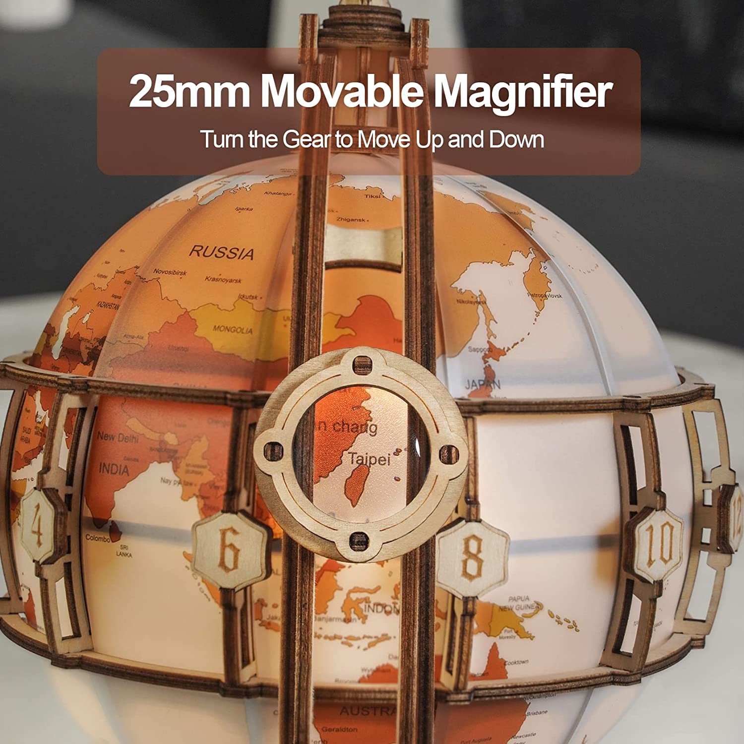 Globe with a movable magnifier labeled '25mm Movable Magnifier' on a blurred background.