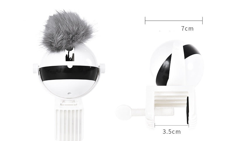 Black and white decorative item with pom-pom on a white background