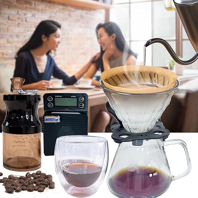 Coffee-making setup with a grinder, scale, filter, and coffee beans in a kitchen setting.