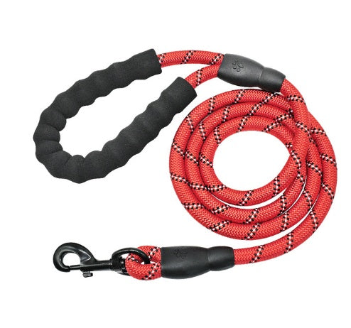 Red dog leash with black handle and clip on a white background
