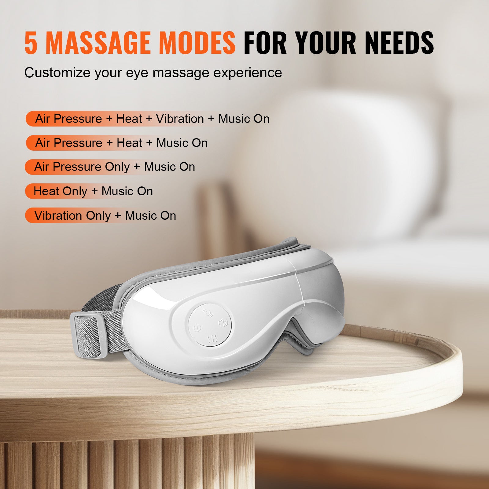 White eye massager on a wooden surface with massage mode options displayed.