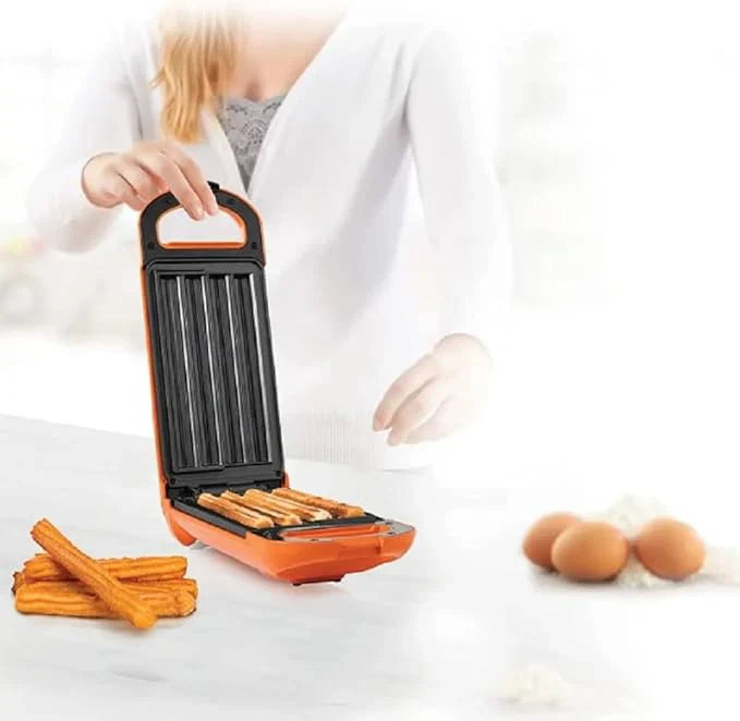 Person using a small grill with ingredients on a white background