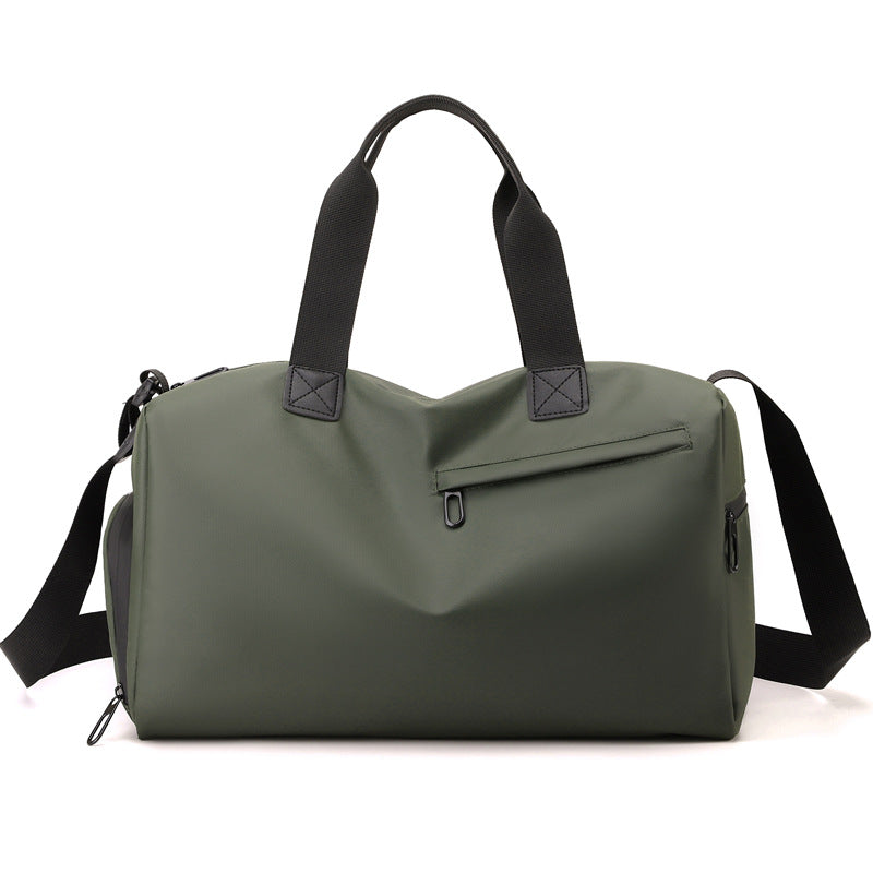 Green duffel bag with black straps on a white background
