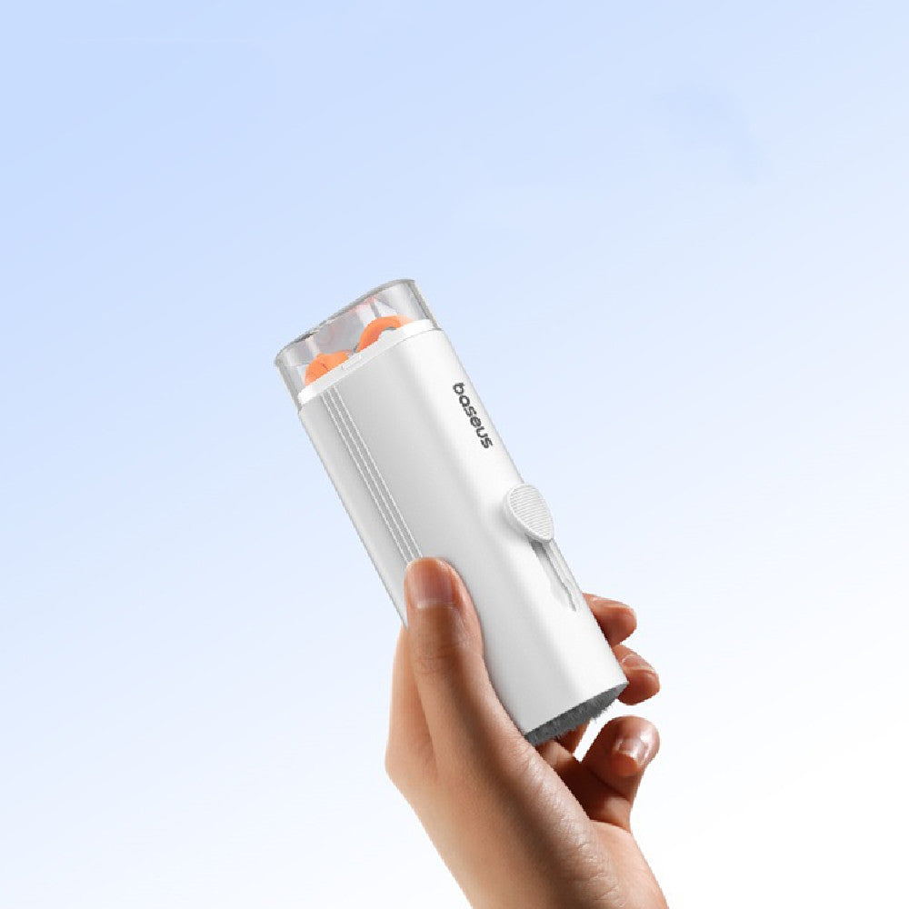 Hand holding a white and gray device with a light blue background