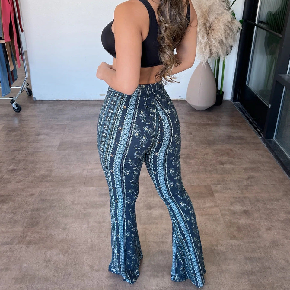 Person wearing blue patterned pants in an indoor setting