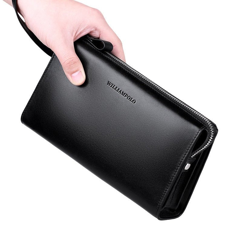 Black wallet held by a hand with 'WILLIAMPOLO' branding on a white background