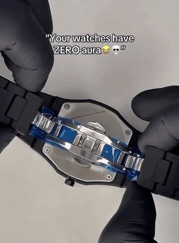 person showing a black Arabic men wrist watch