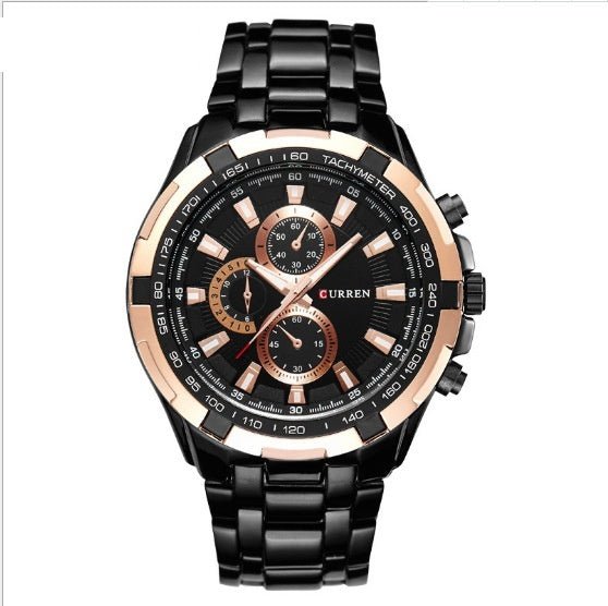 Black and rose gold watch with detailed face on a white background