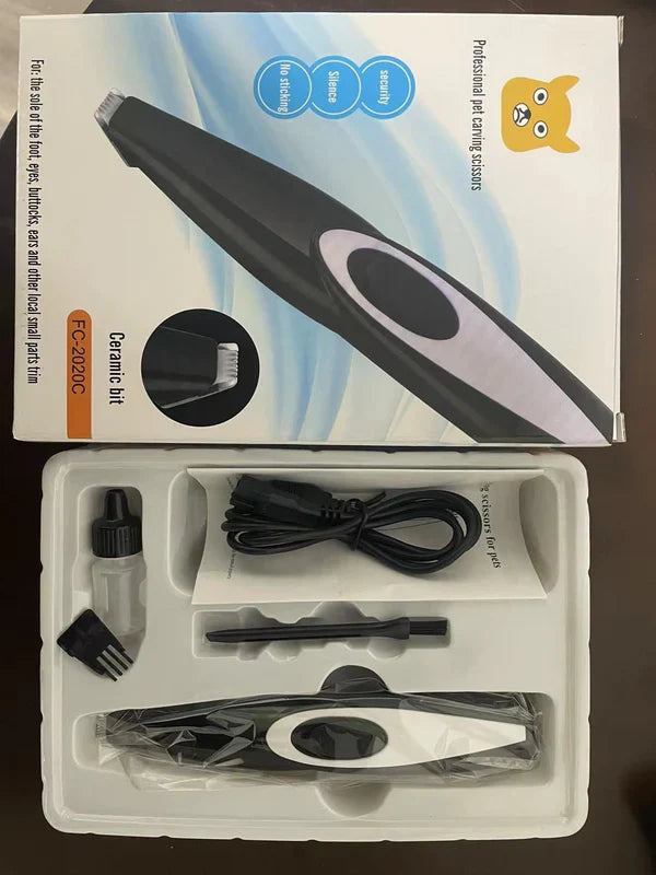 Pet grooming tool set with packaging on a dark surface