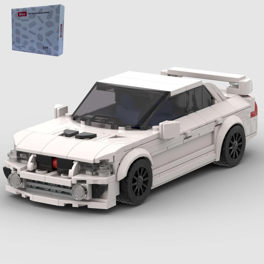 White model car made of building blocks on a light gray background