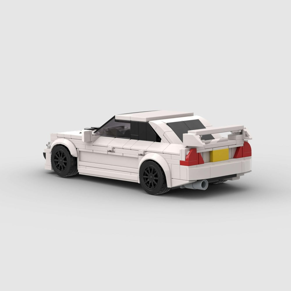 White toy car model on a light gray background
