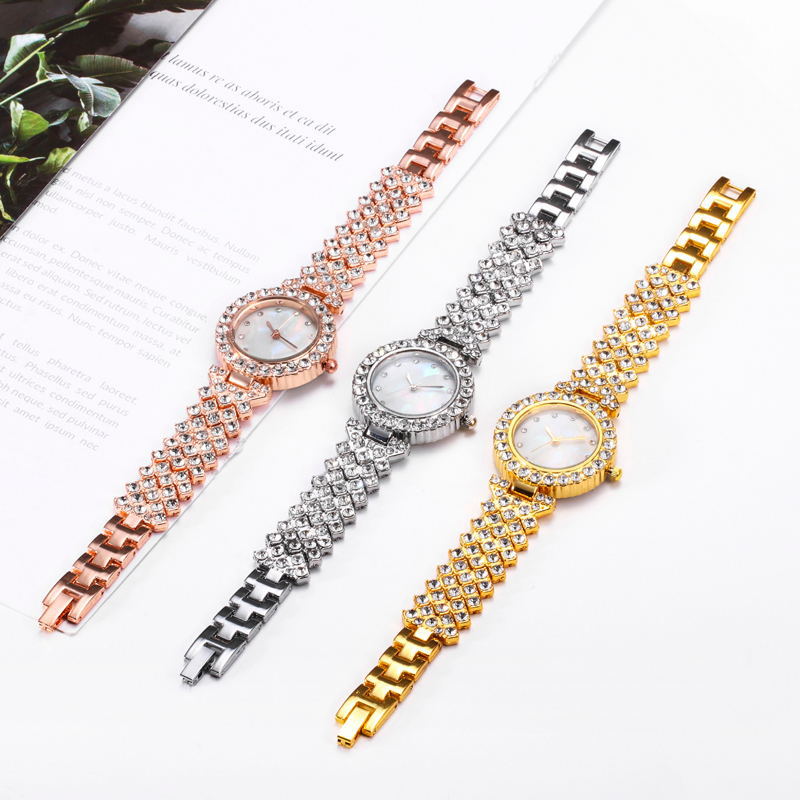Three elegant wristwatches with rose gold, silver, and gold metal bands on a white background.
