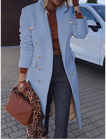 Person wearing a light blue coat with gold buttons, holding a brown handbag with a leopard print pattern.