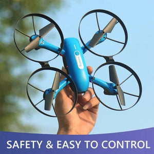 Hand holding a blue drone with a clear sky background